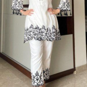 Elegant white top and pant with heavy embroidery.